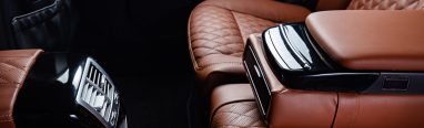 A luxury car interior in brown and black colors