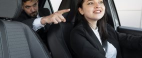 young-female-being-uber-driver-male-client
